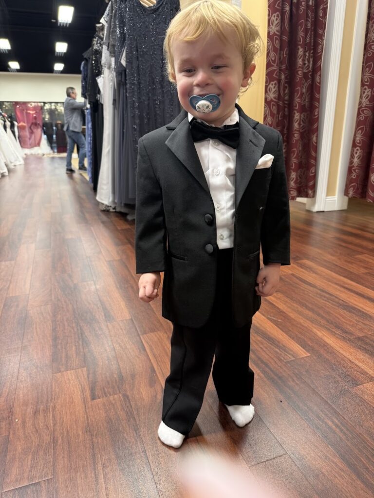 Renting a tuxedo or suit may include a ring bearer!