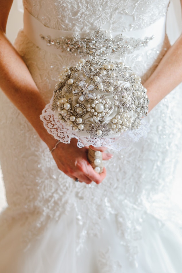 A woman holding her bridal bouquet