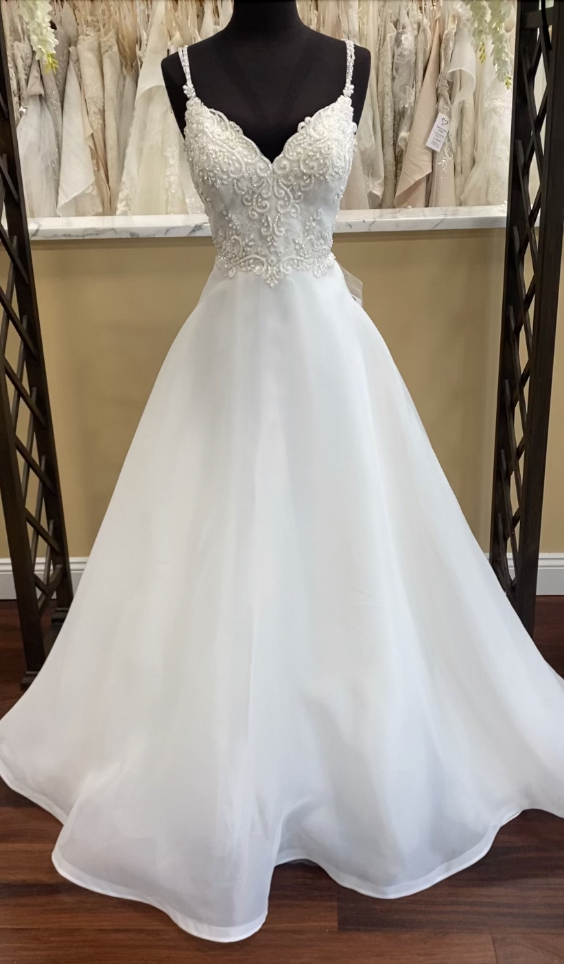 Wedding dress with double beaded straps, ornately, beaded, bodice, and plain organza align skirt