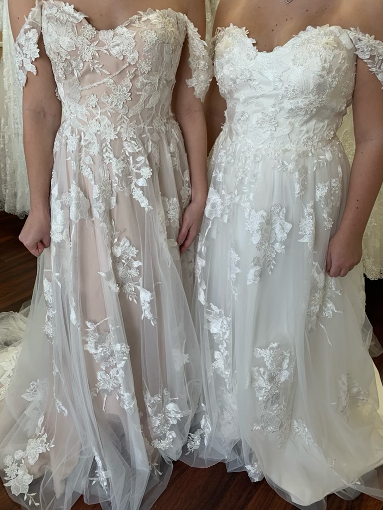 Nude Madi Lane wedding dress next to white wedding dress
