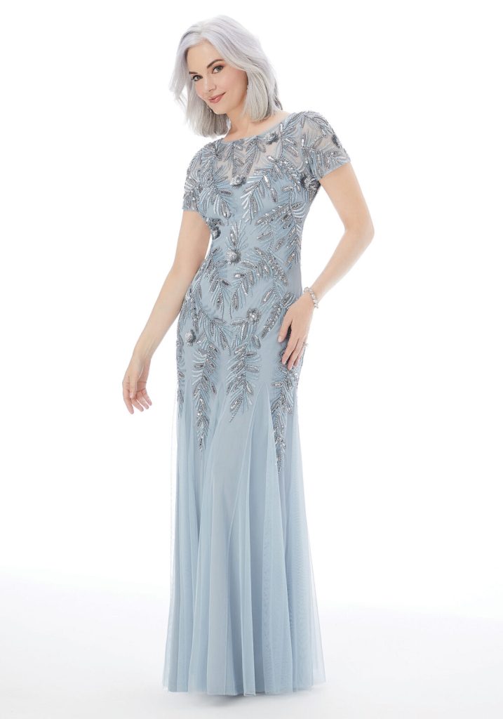 A sheath dress with a beaded bodice, matching beaded short sleeves, and a chiffon skirt in the color cornflower blue