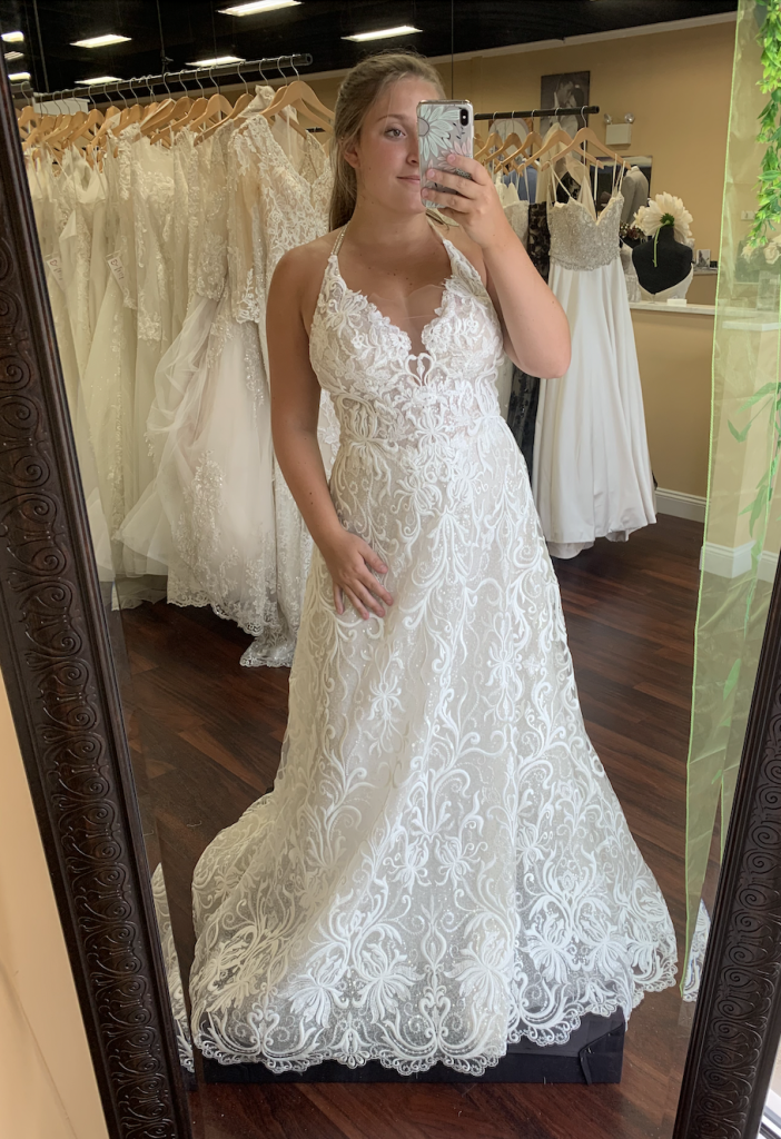 Tatiana dress by Casablanca has a layer of sparkle underneath the embroidered lace pattern, double beaded straps that can be worn straight or as shown as halter, and a perfect a line shape for her body