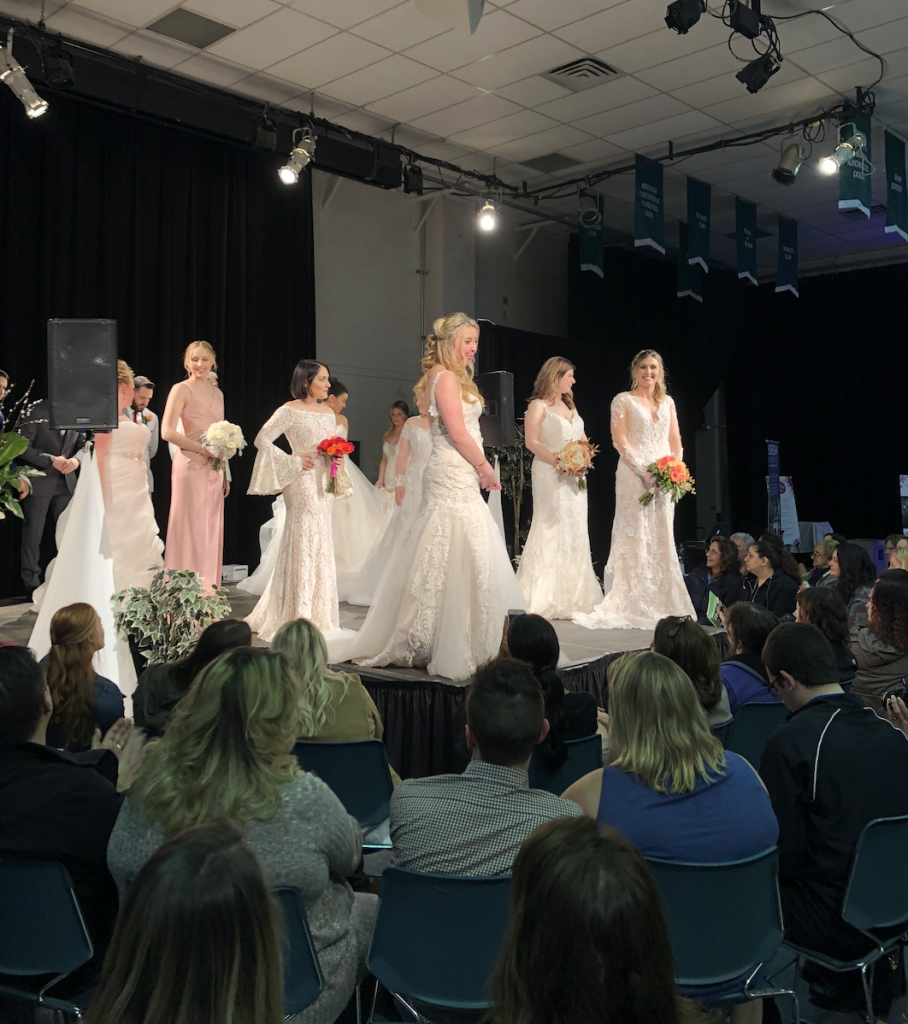 Darianna Bridal & Tuxedo Bridal models taking their final walk at the visit bucks county wedding show held at Delaware Valley University in March 2019