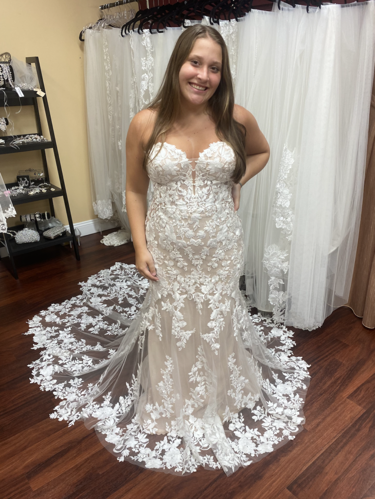 Nesta by Enzoani Blue he's a strapless mermaid dress with a sweetheart neckline and a beautiful floral lace pattern with a subtle sparkle throughout