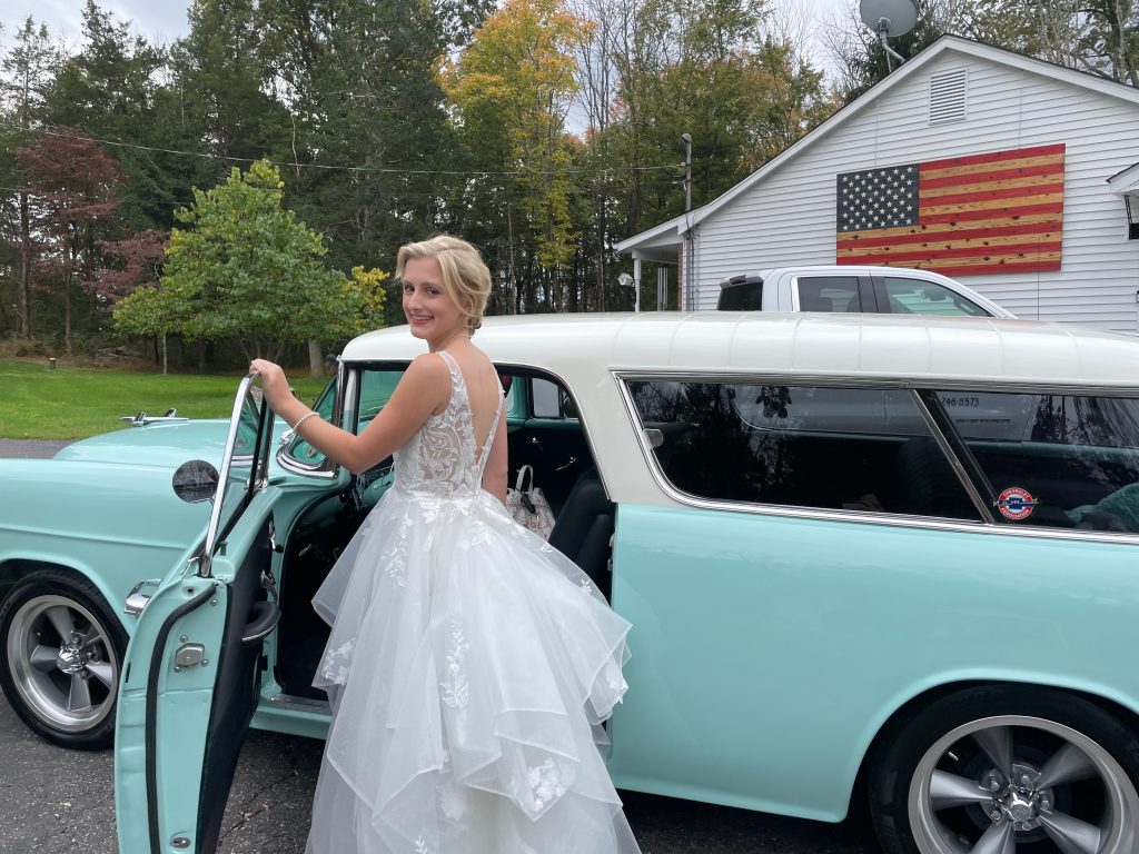 Sarah with her 1955 turquoise blue Chevy nomad, perfectly detailed by her friend Derek, owner of Precision Care Detailing