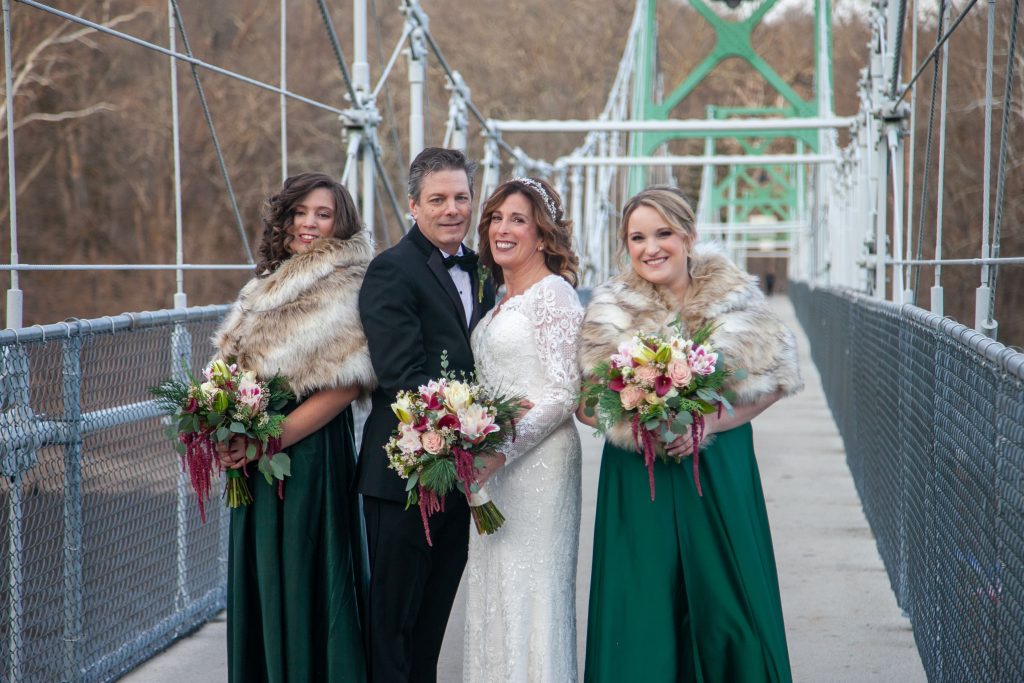Bride and groom with their daughters on the Lumberville PA foot bridge