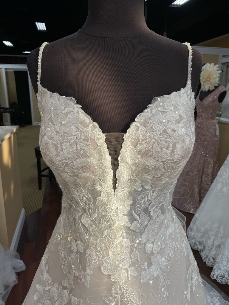 Beaded straps and sequined lace applique on Stella York 7404 dress are so romantic