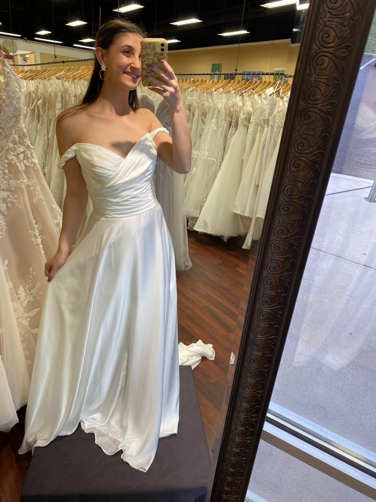 Wedding dress consultant Courtney models the Dior dress by Madi Lane bridal