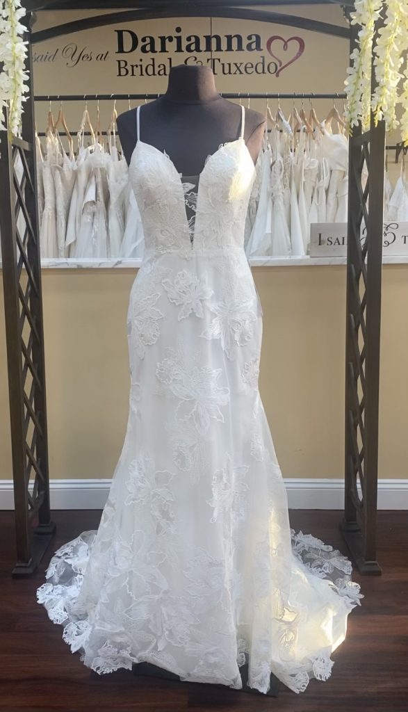 Daria dress by Madi Lane bridal is a fitted lace over charmeuse wedding dress with a plunge neck and spaghetti straps