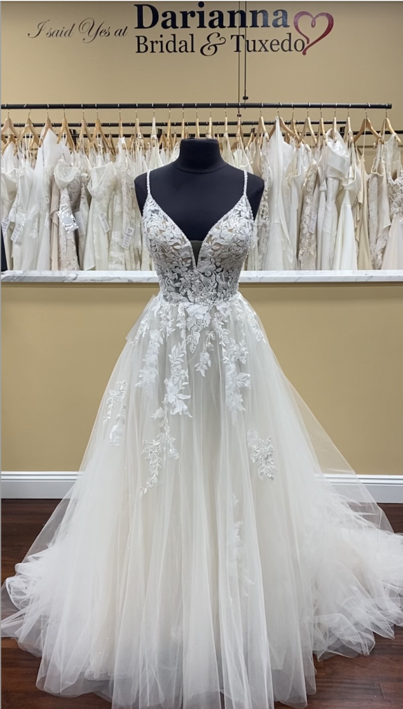Omarra from Enzoani Bleu is a layered tulle ballgown with spaghetti straps, sparkle and applique