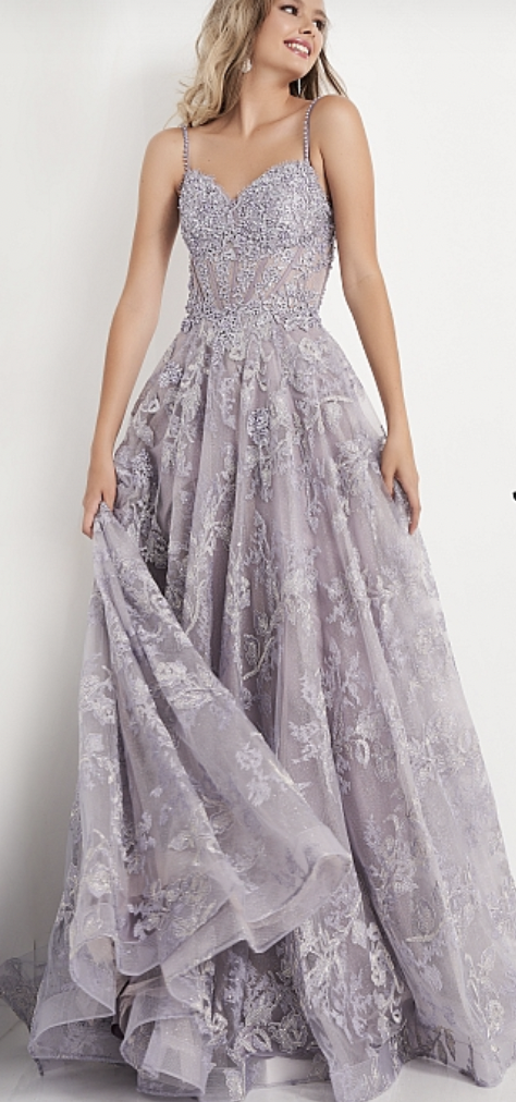 Heather is one of the trending prom colors for 2022! This dress with lace flower details and beaded straps is perfect for prom from JVN by Jovani