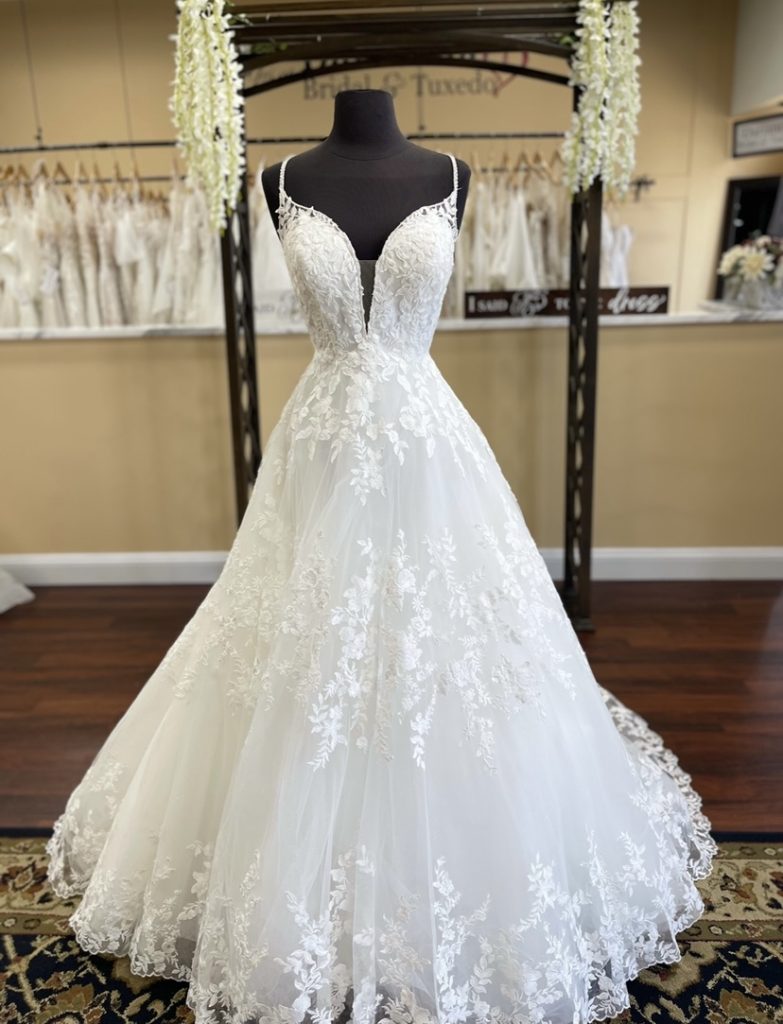  Petra by Eddy K, a stunning ballgown with lace, beading, and a beautiful cathedral train with a finished lace hemline
