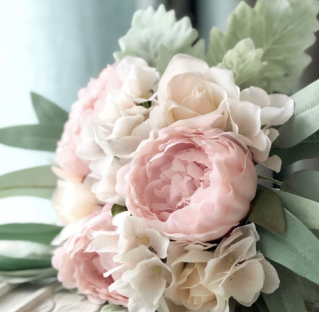 Pink peony wedding flowers in a bridal bouquet