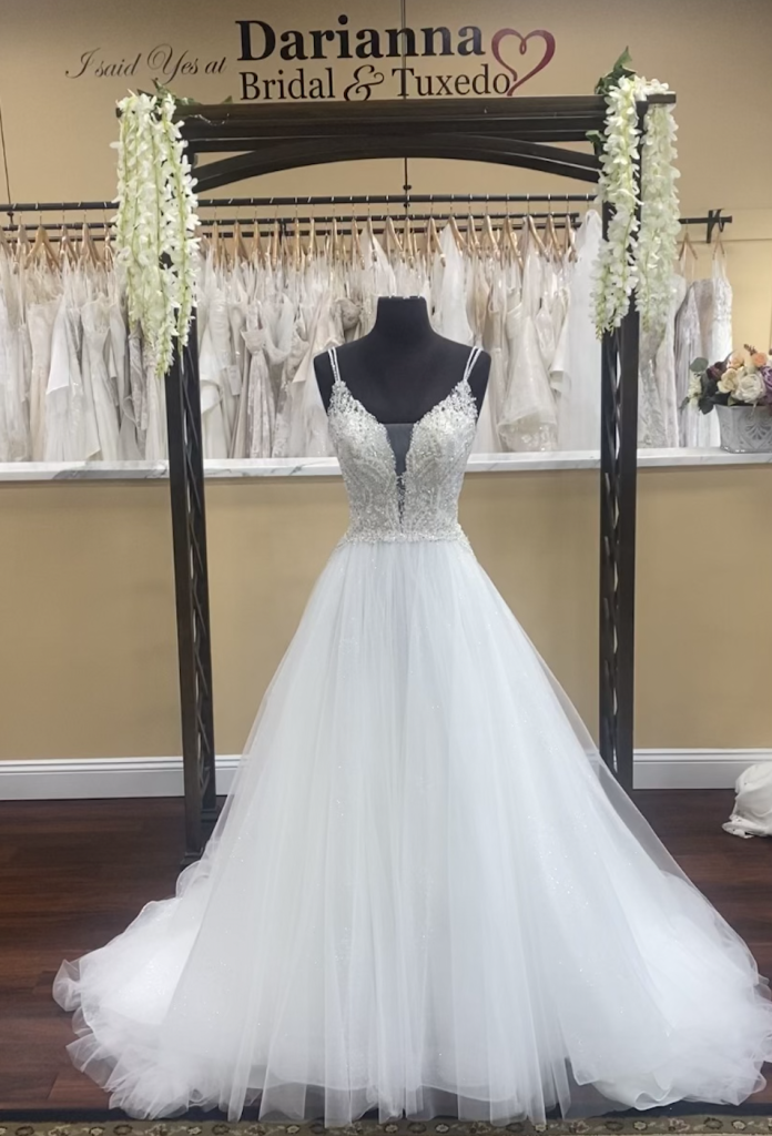Carrie by Casablanca bridal is a beautiful beaded ball gown with a shimmery skirt