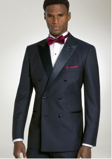 Navy double breasted tuxedo with peak lapel, apple colored tie and pocket square