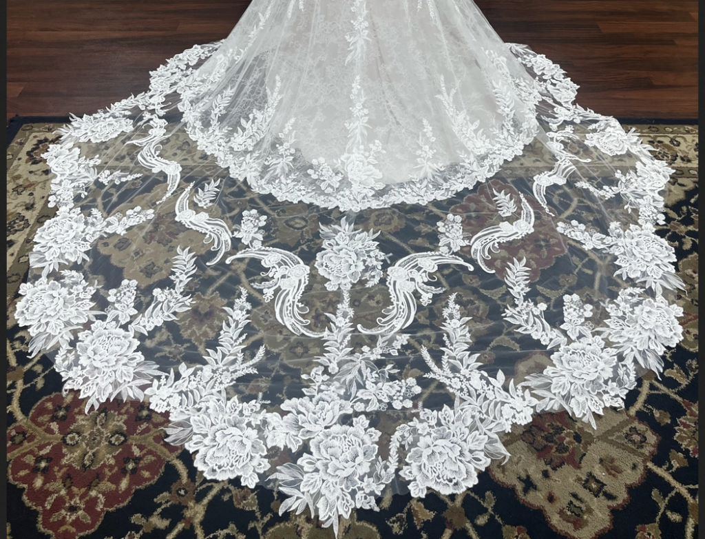 Beautiful rosette lace detail on cathedral train of Aviana