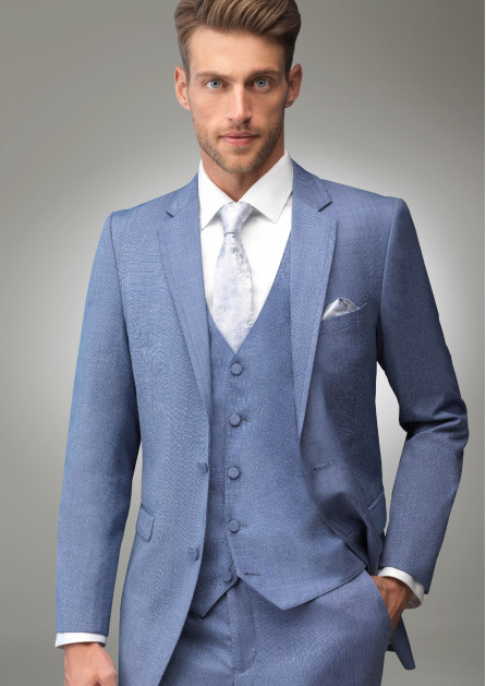 Model in Cornflower blue tuxedo with matching vest and light blue and lavender tie and pocket square
