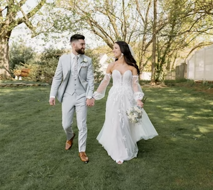 Groom in the gray Griffin suit and bride in her modified Bea dress by Madi Lane