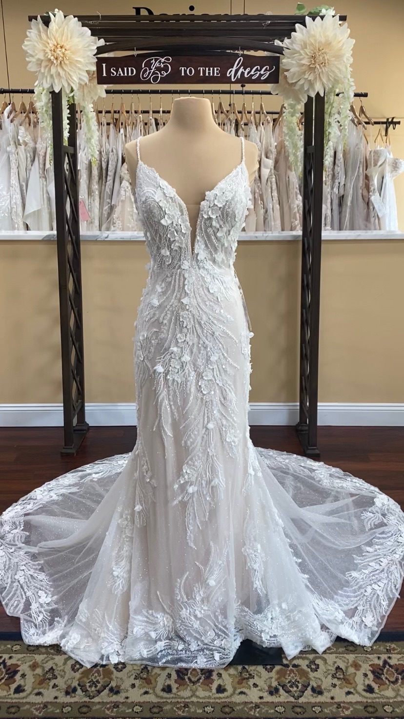 Eddy K Cynthia wedding dress is a glamorous beaded and lace fit and flare
