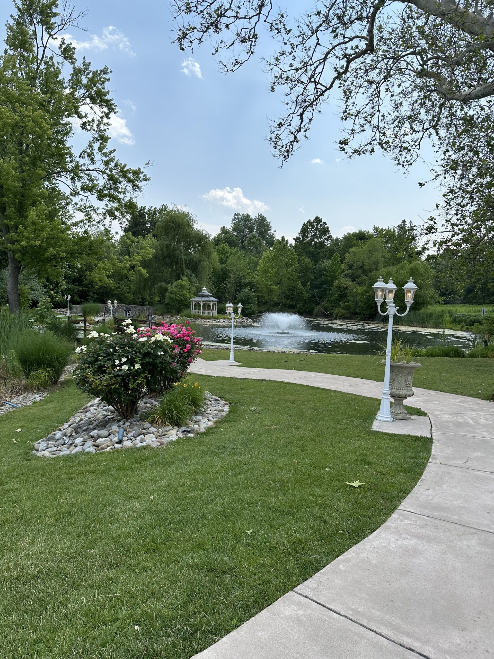 The manor house at prophecy creek offers, winding pathways and ponds, manicured and mature, landscaping perfect for photos