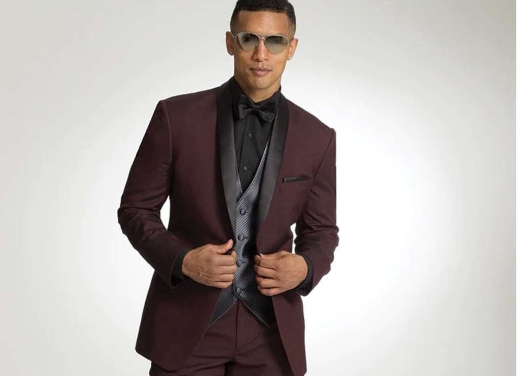 Burgundy, tuxedo, jacket, and pants with black vest, shirt, and bowtie