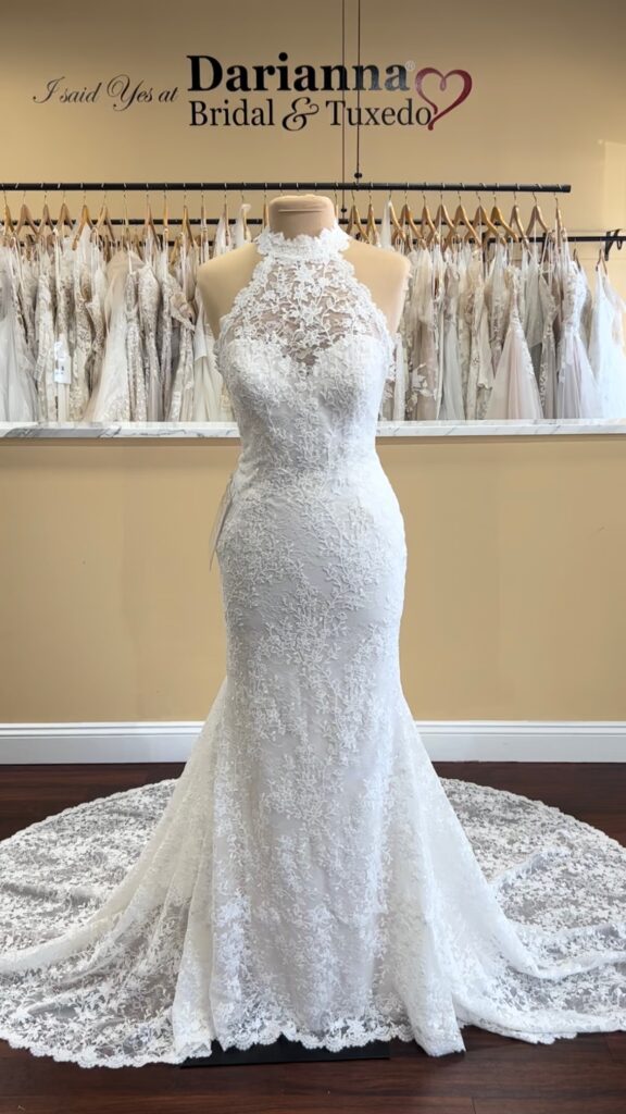 Vintage halter wedding dress, lace-edged collar neckline, column shape, lace train with buttons.
