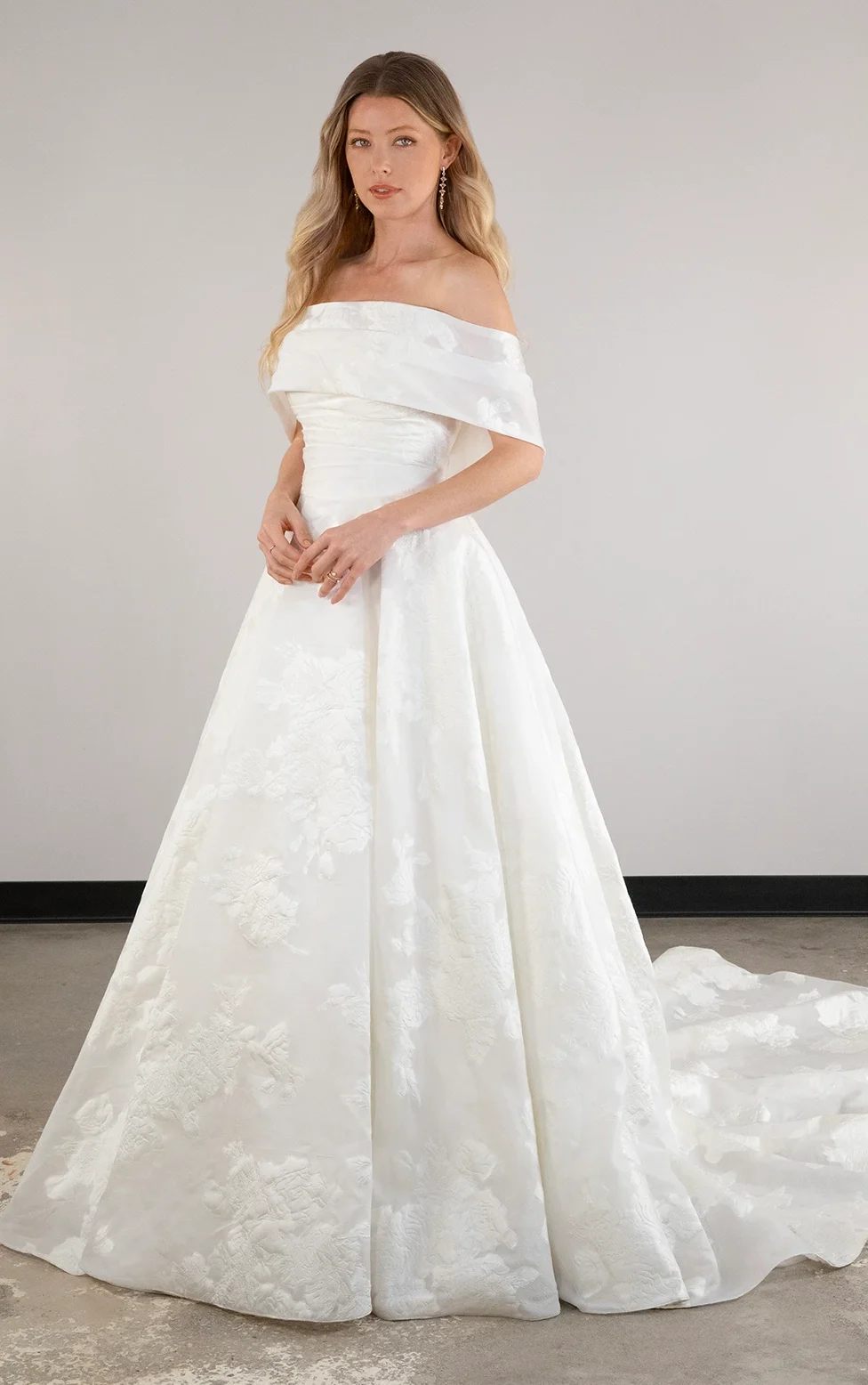 Jacquard print princess wedding dress with off the shoulder cape by Essense of Australia princess dresses
