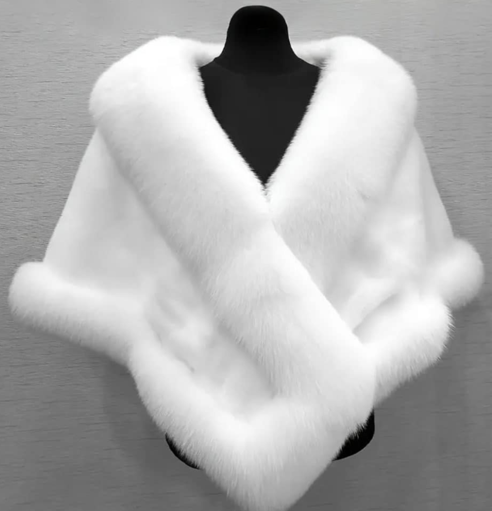 Cape with fur accessory for a winter wedding dress