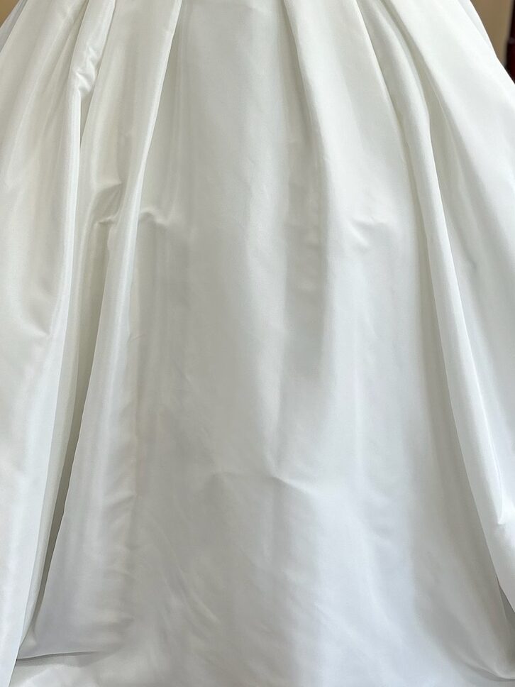 Satin is a good fabric for a winter wedding dress