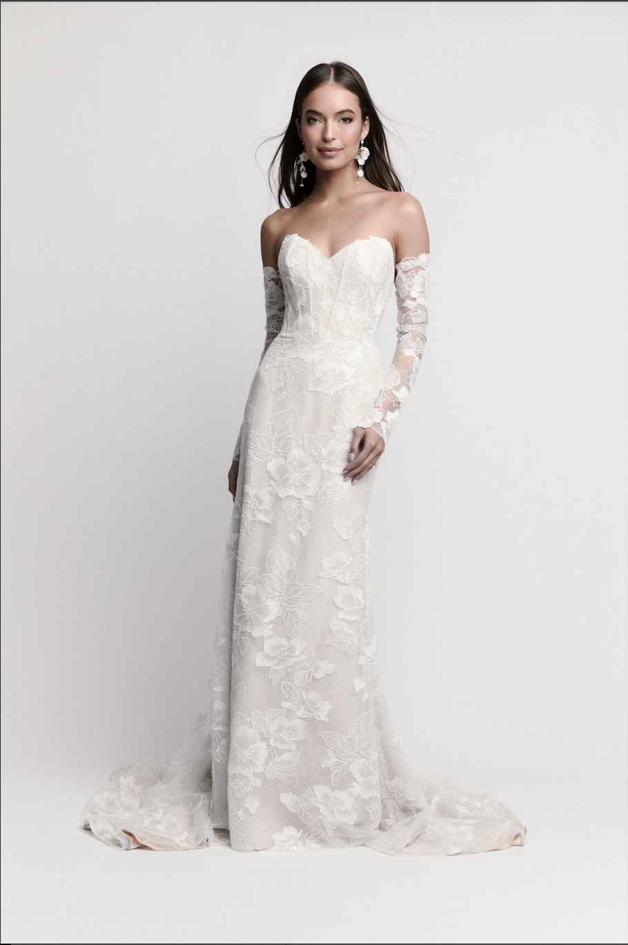 Bride modeling off-the-shoulder floral lace wedding dress by WToo by Watters with long lace sleeves