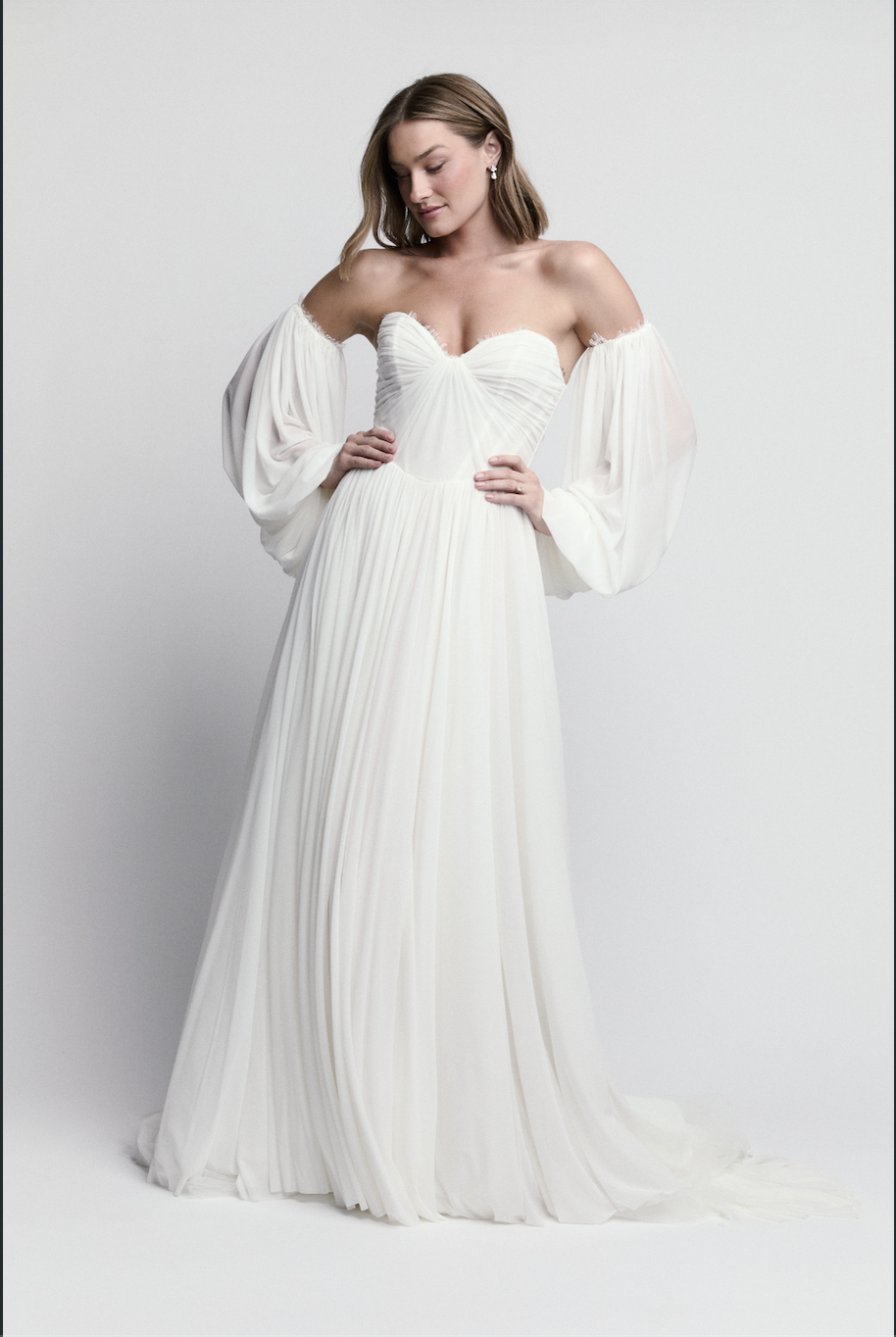 Bride modeling chiffon wedding dress by WToo by Watters with sweetheart neckline and bishop sleeves