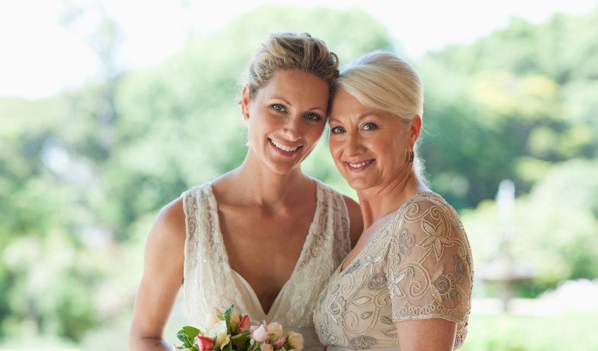 Mother and bride hugging